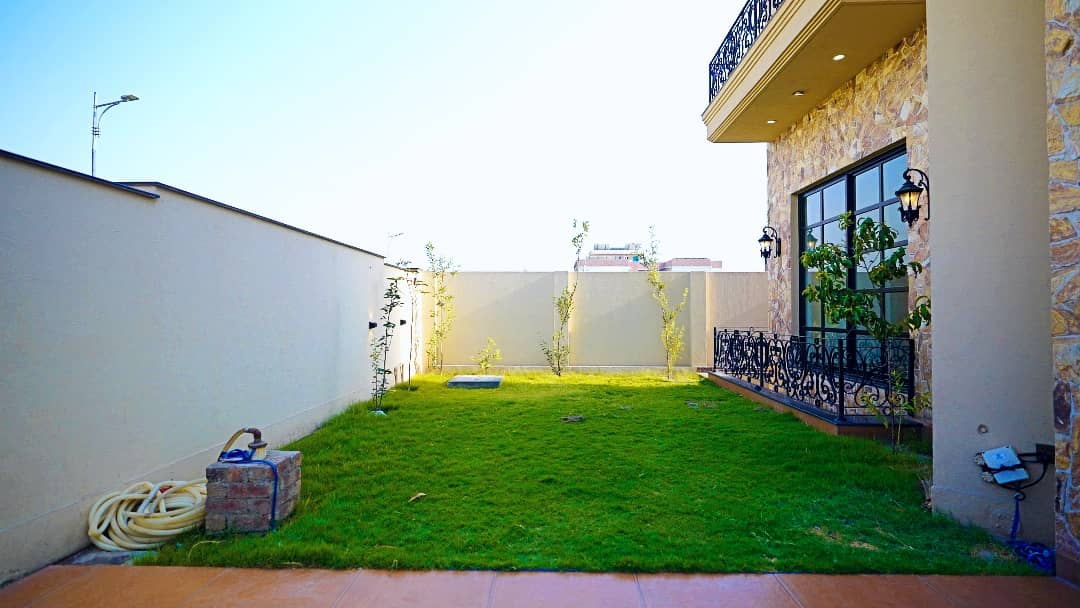 1 Kanal Designer House in DHA Phase 7 | Stone Exterior, Full Basement & Double Lawns 4