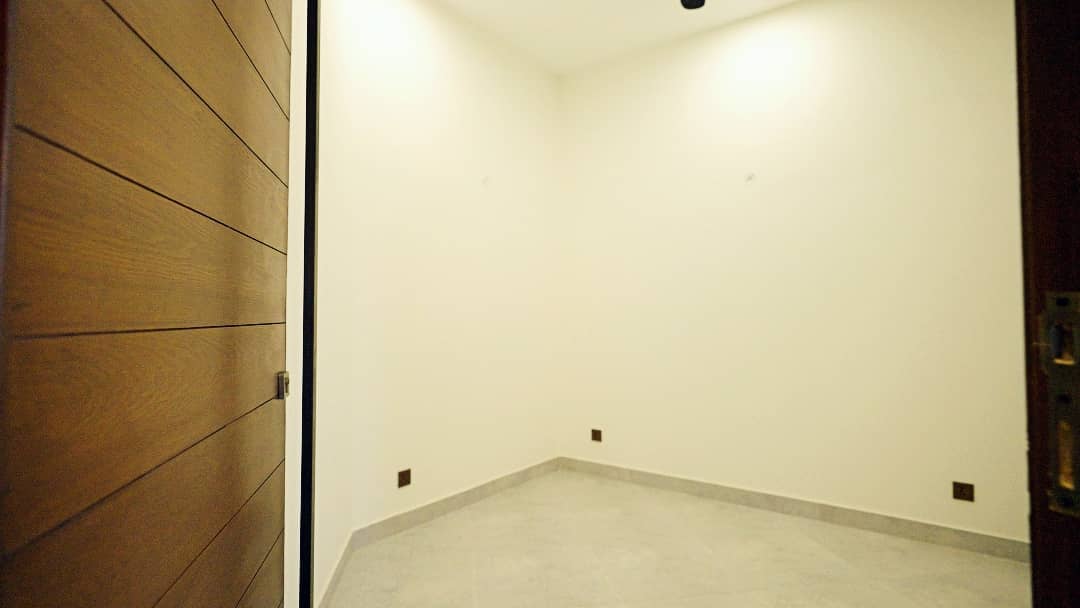 1 Kanal Designer House in DHA Phase 7 | Stone Exterior, Full Basement & Double Lawns 28