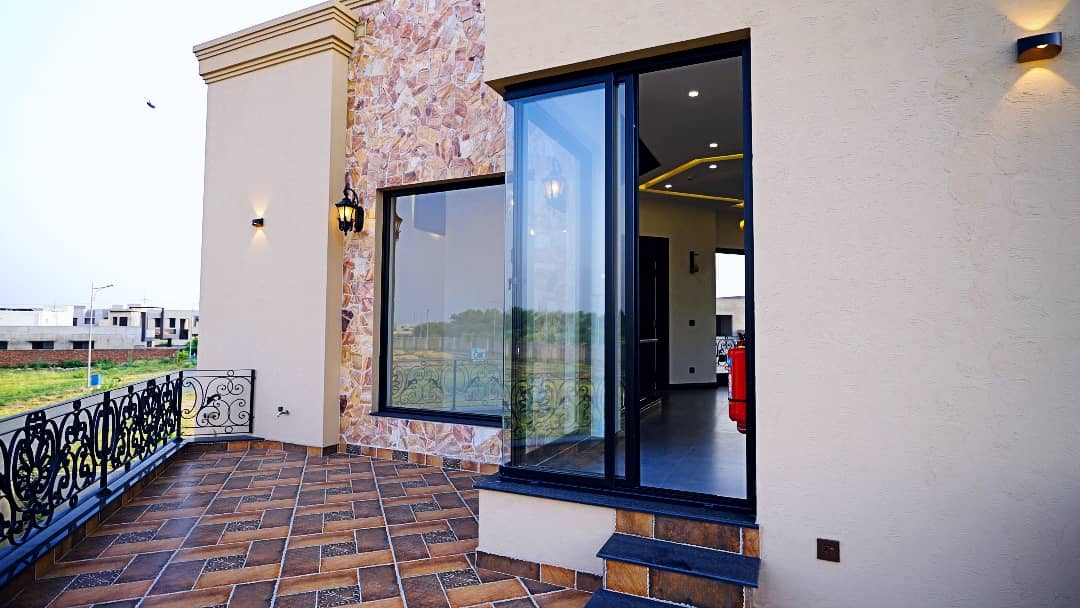 1 Kanal Designer House in DHA Phase 7 | Stone Exterior, Full Basement & Double Lawns 30