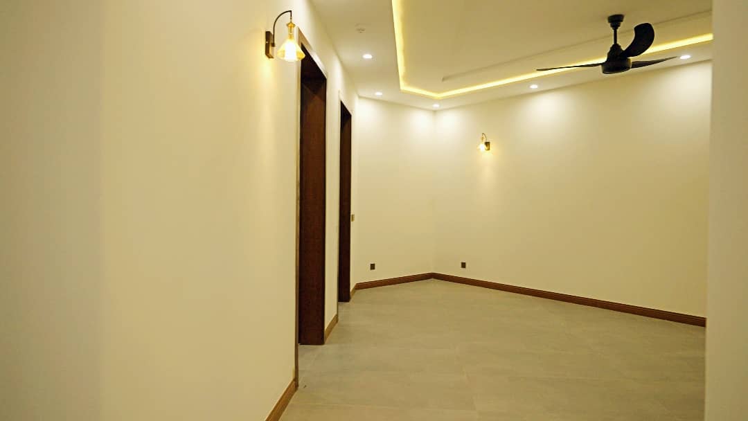 1 Kanal Designer House in DHA Phase 7 | Stone Exterior, Full Basement & Double Lawns 37