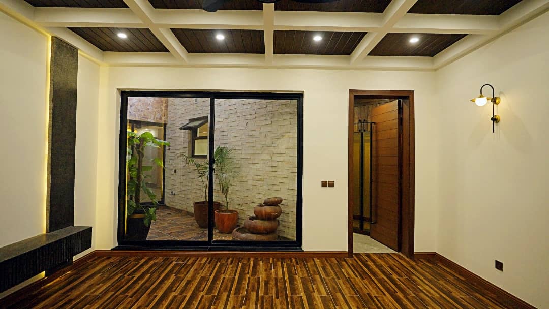 1 Kanal Designer House in DHA Phase 7 | Stone Exterior, Full Basement & Double Lawns 40